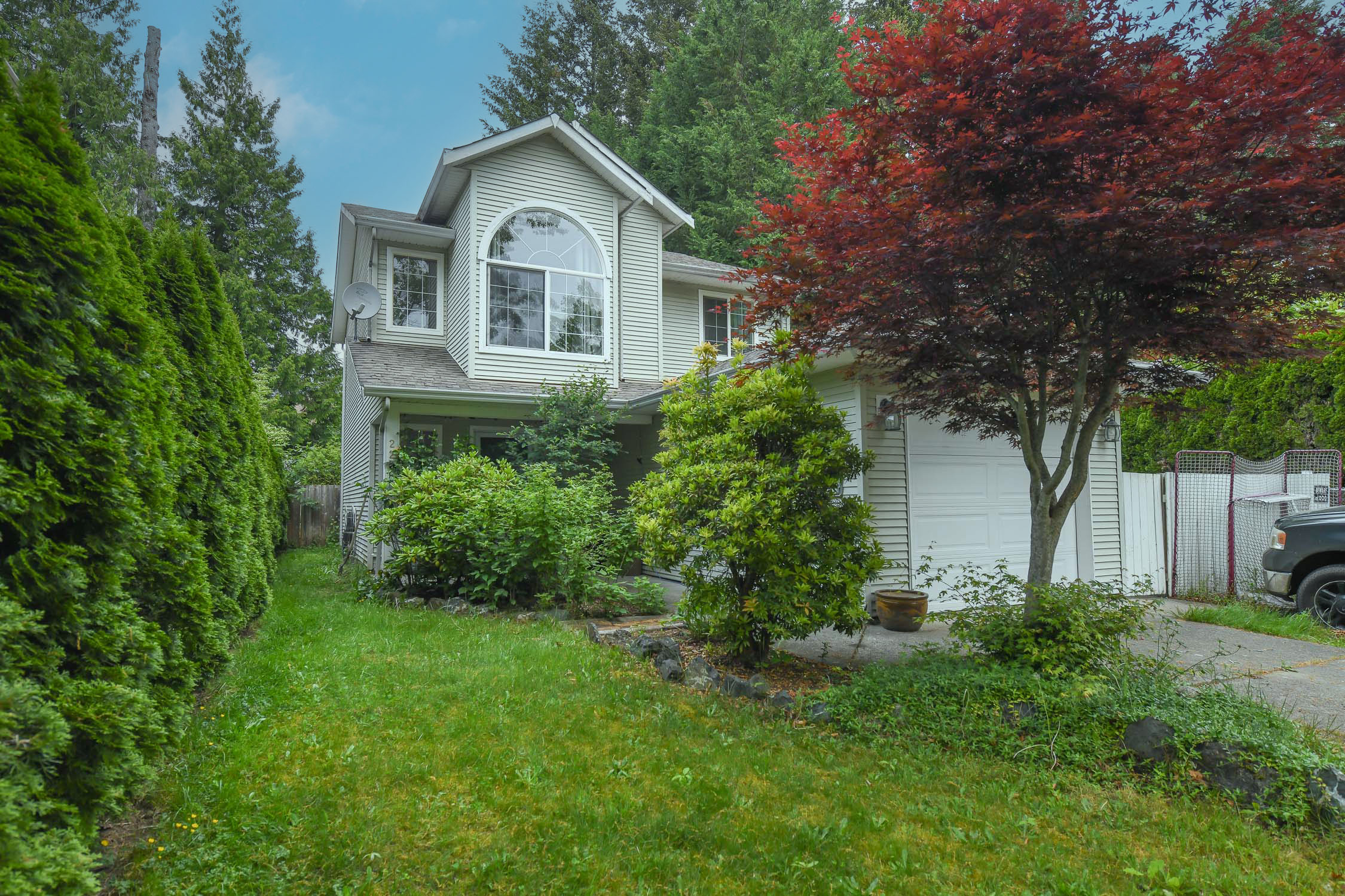 Charming family home at 2238 Tamarack Dr in Courtenay featuring a functional layout, single-car garage, and fully fenced backyard in a desirable East Courtenay neighborhood close to schools and amenities.