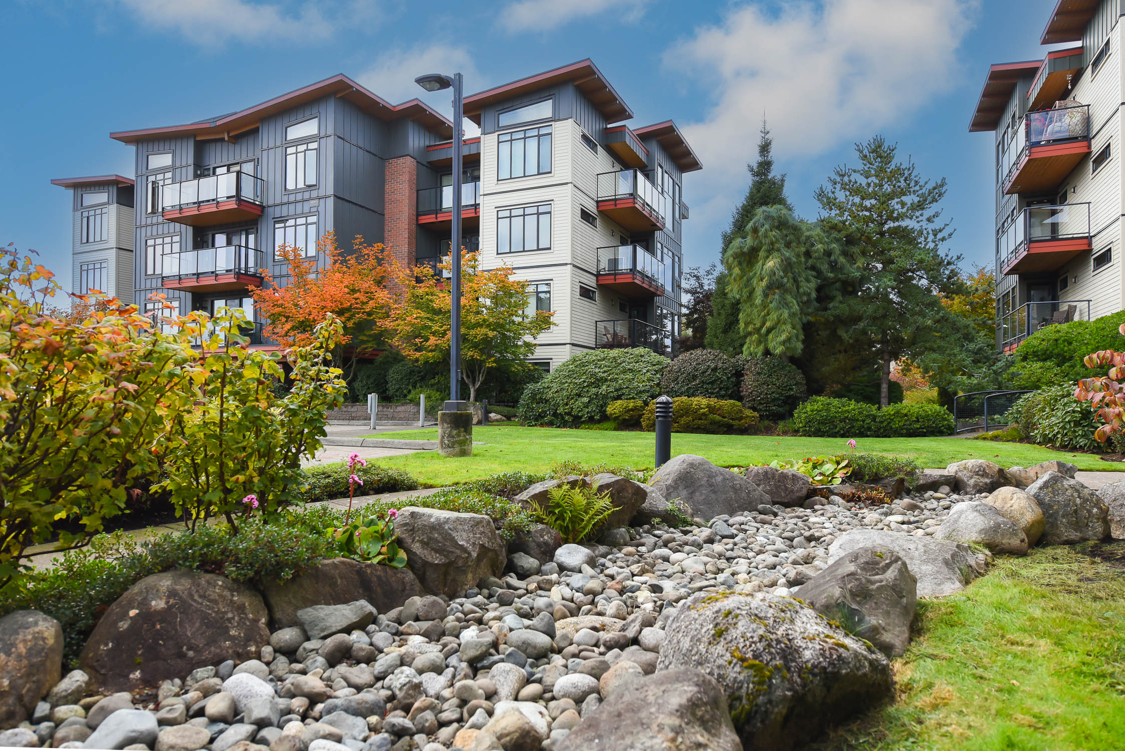 top floor condo at 142 2300 mansfield dr courtenay bc featuring ocean and mountain views with vaulted ceilings and modern design
