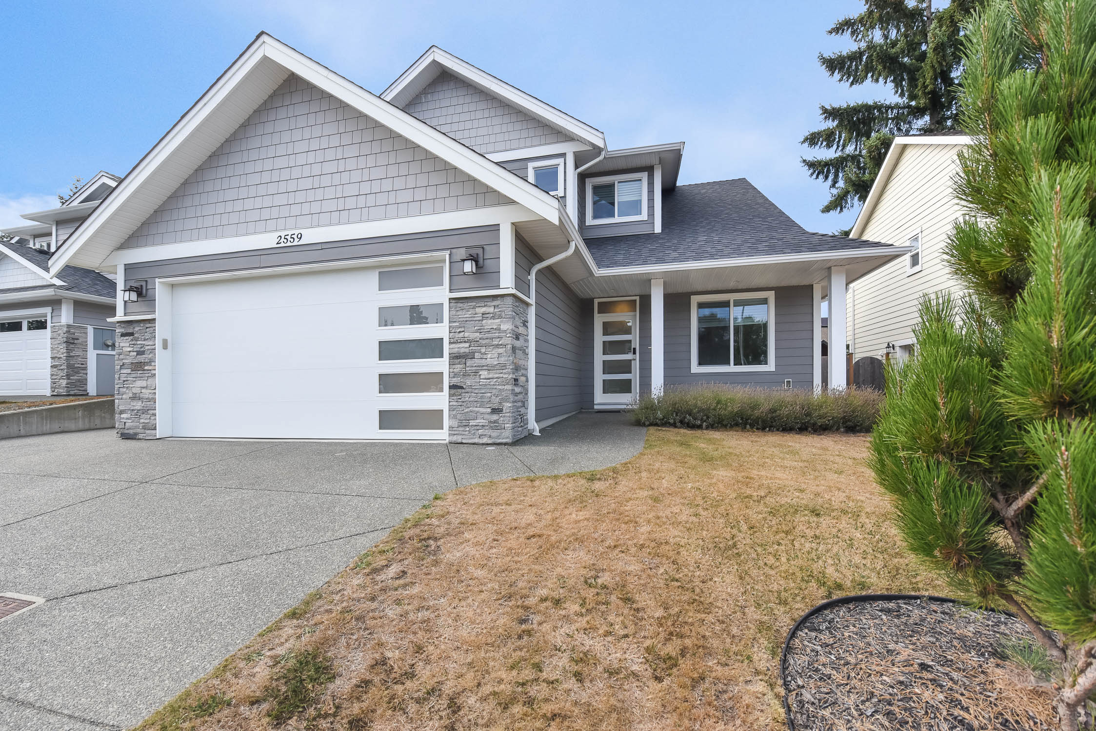 Image Description: Coming soon 2559 Brookfield Dr Courtenay BC, an immaculate 2018-built four-bedroom home with main-level living, modern finishes, EV charger, fenced yard and peaceful green space.