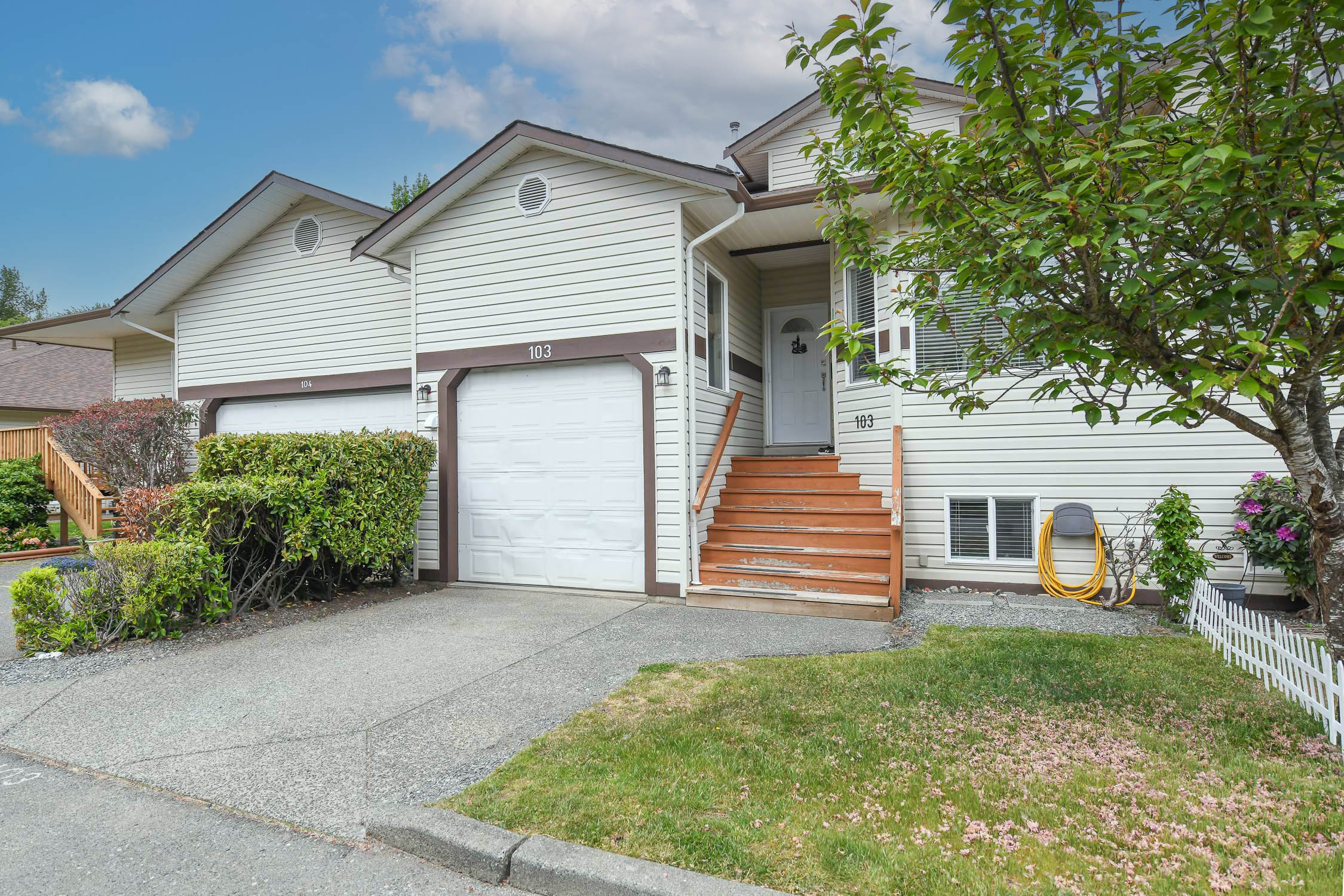 Beautifully updated 5-bedroom townhome at #103 2727 1st St in Courtenay featuring a custom kitchen, self-contained in-law suite, private backyard, and spacious layout ideal for extended family living.