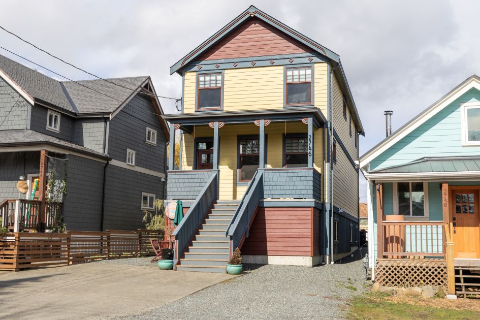 Front exterior view of 2746 Penrith Ave in Cumberland, BC, showcasing a 2022-built Craftsman-style home with clean architectural lines, quality finishes, and strong curb appeal&mdash;highlighting modern Cumberland real estate with a legal Airbnb suite, energy-efficient construction, and prime location near downtown, trails, and Mount Washington access.