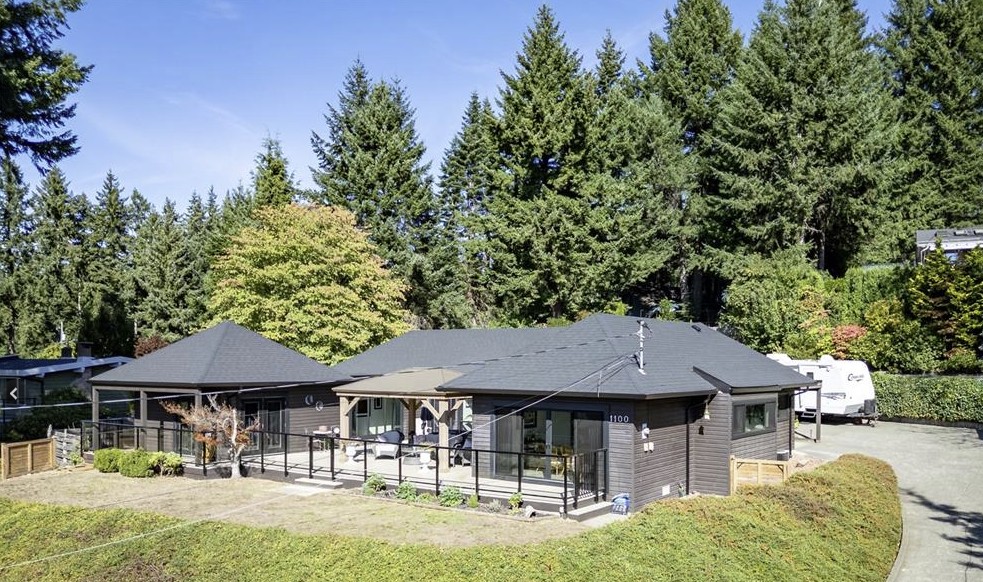 front exterior view of 1100 back rd courtenay bc showing fully renovated rancher with southern exposure and panoramic mountain and glacier views