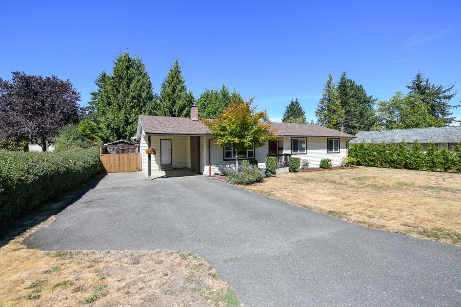 front view of updated rancher at 1964 robb ave comox with landscaped walkway and welcoming entrance