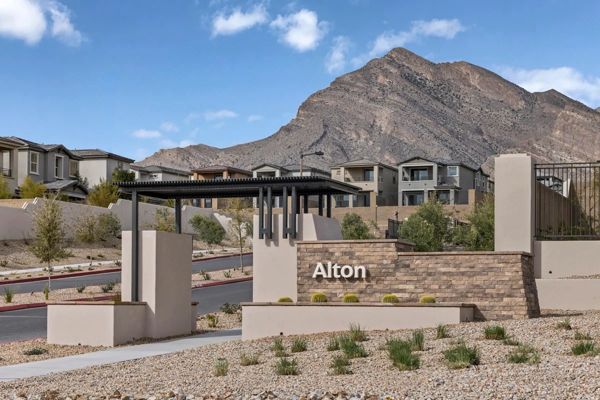 Alton entry monument with homes and a mountain in the background