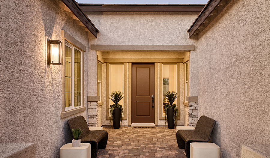 Covered front entry of a home at Cactus Bloom by Richmond American Homes