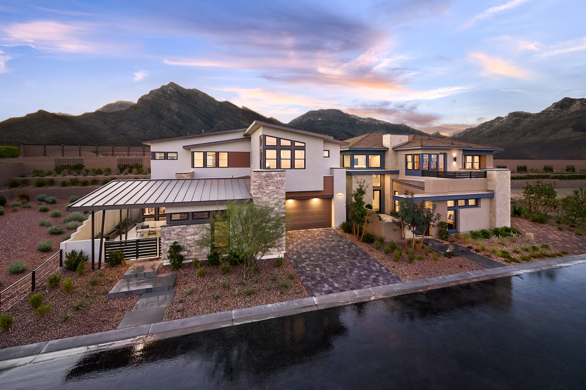Modern homes at Carlisle Peak by Tri Pointe Homes at sunset with mountain views