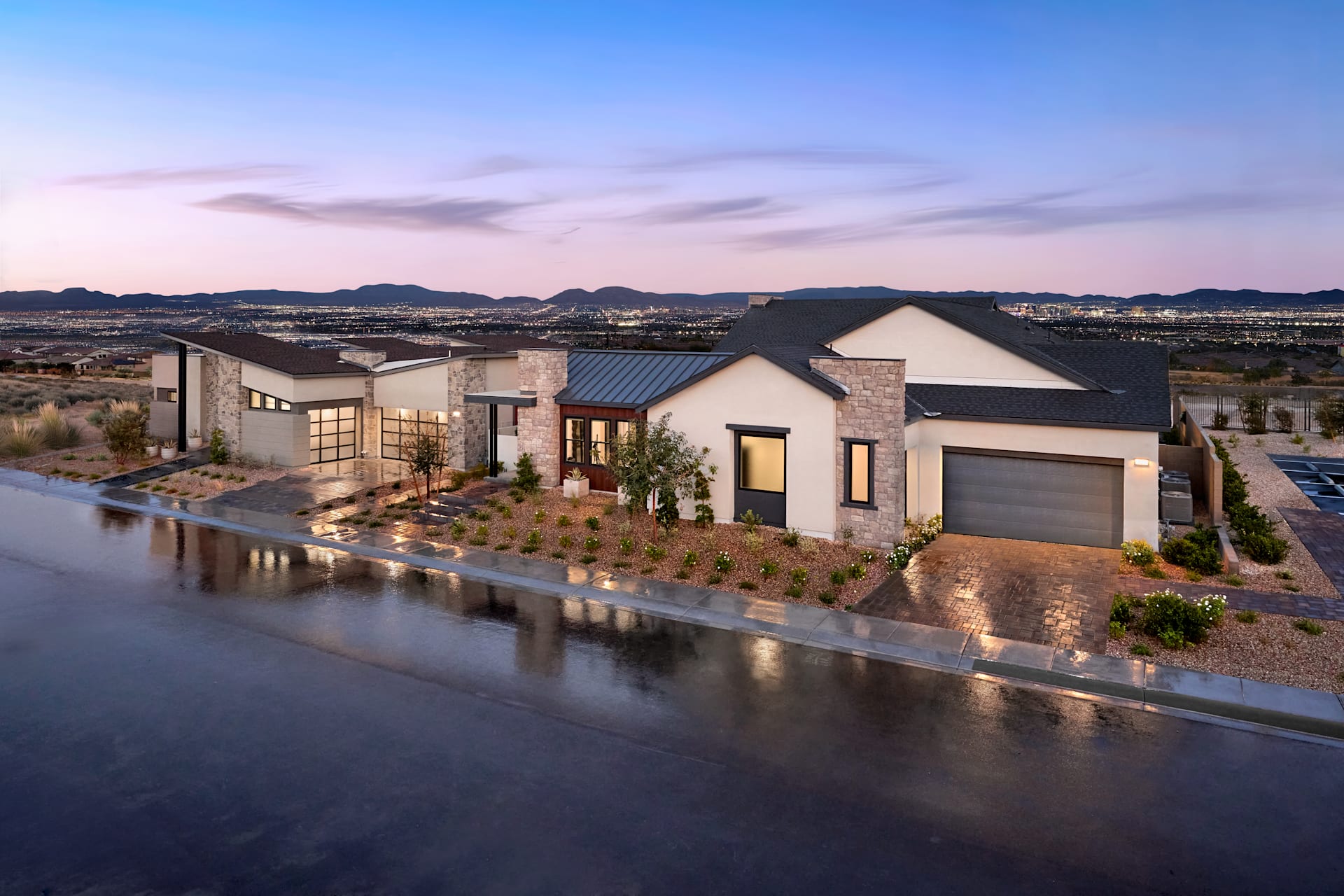 Single-story modern homes at Carlisle Ridge by Tri Pointe Homes at dusk