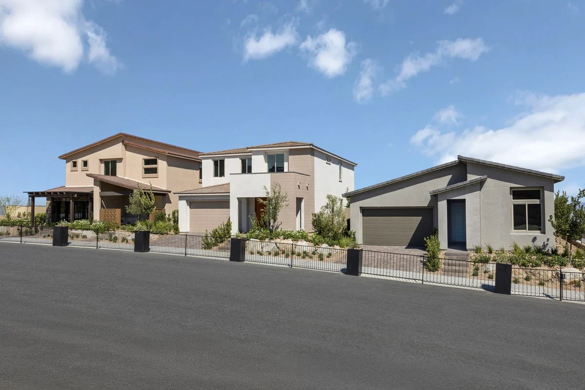Two-story and single-story model homes along a street at Cloudbreak Ridge by KB Home