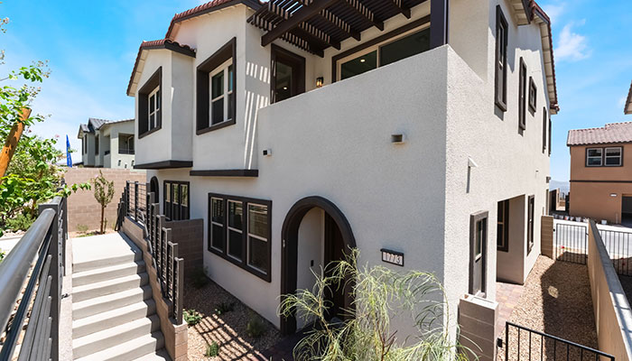 Townhome exterior with front steps at Dove Rock by Woodside Homes