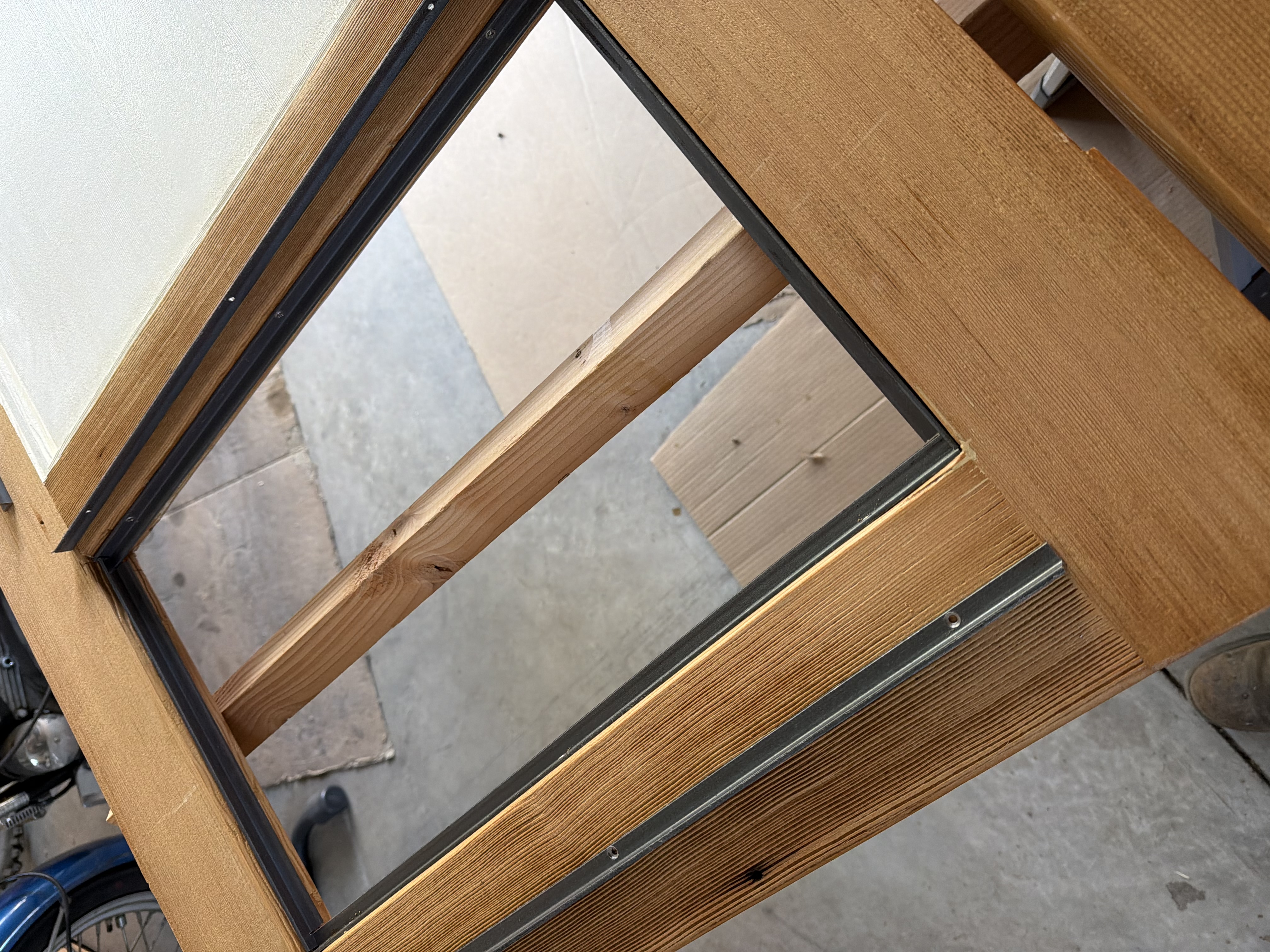 Angle iron framing to support the perforated metal door panels