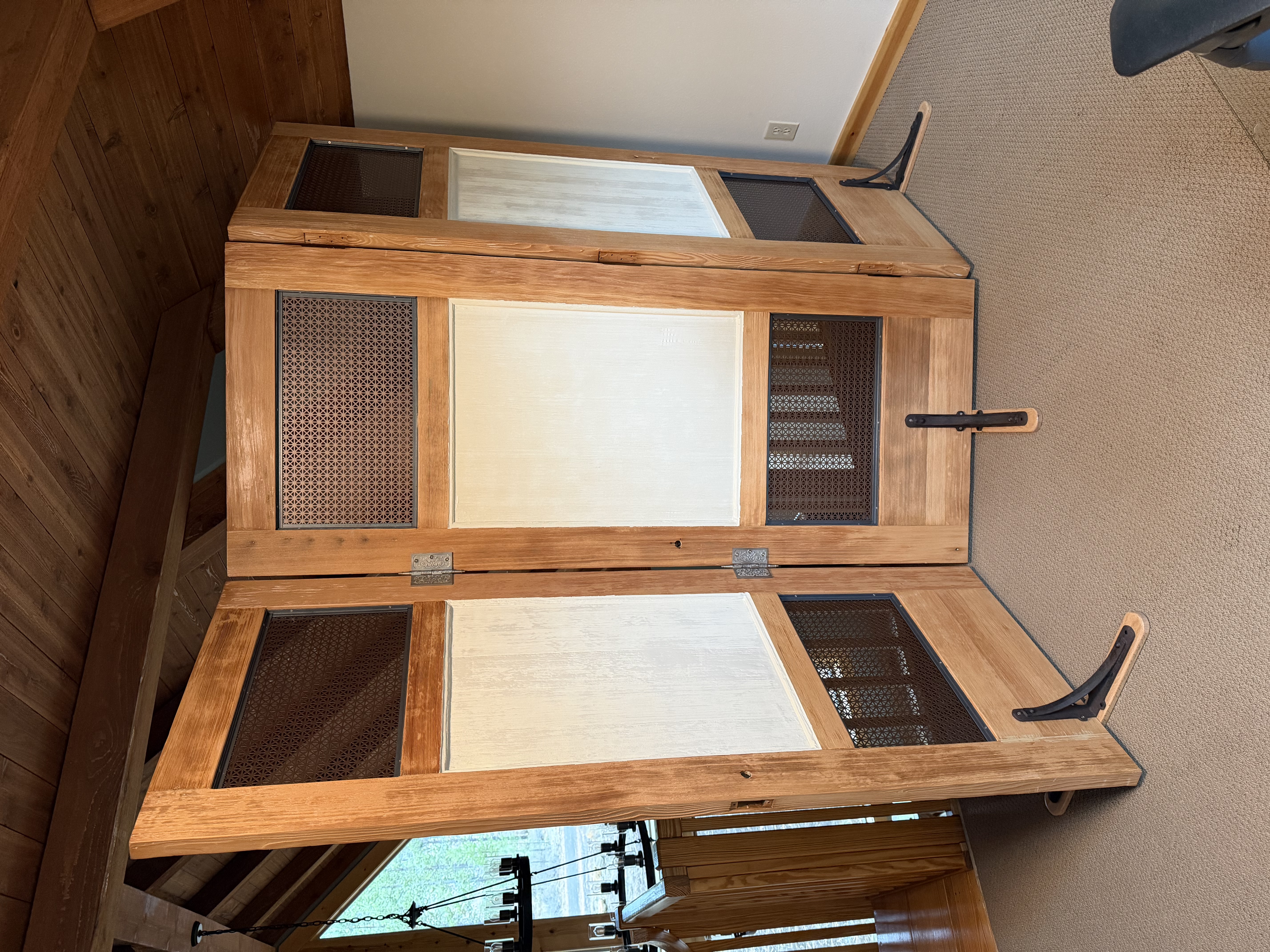 Repurposed vintage farmhouse doors used as a room divider