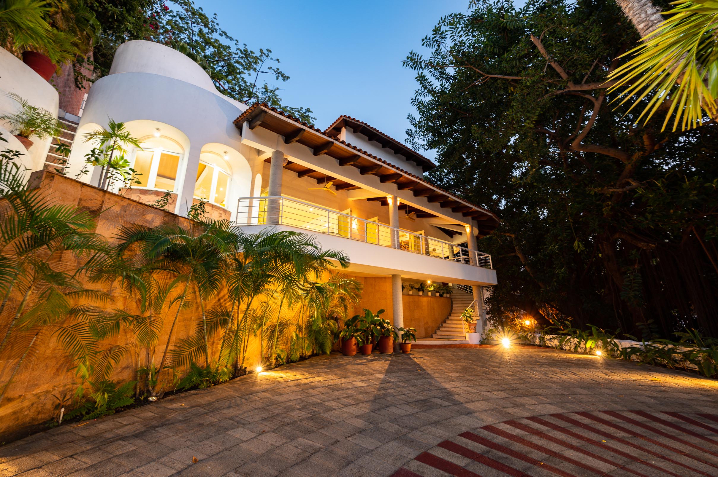 Casa Talisman exterior with terraces and tropical landscaping