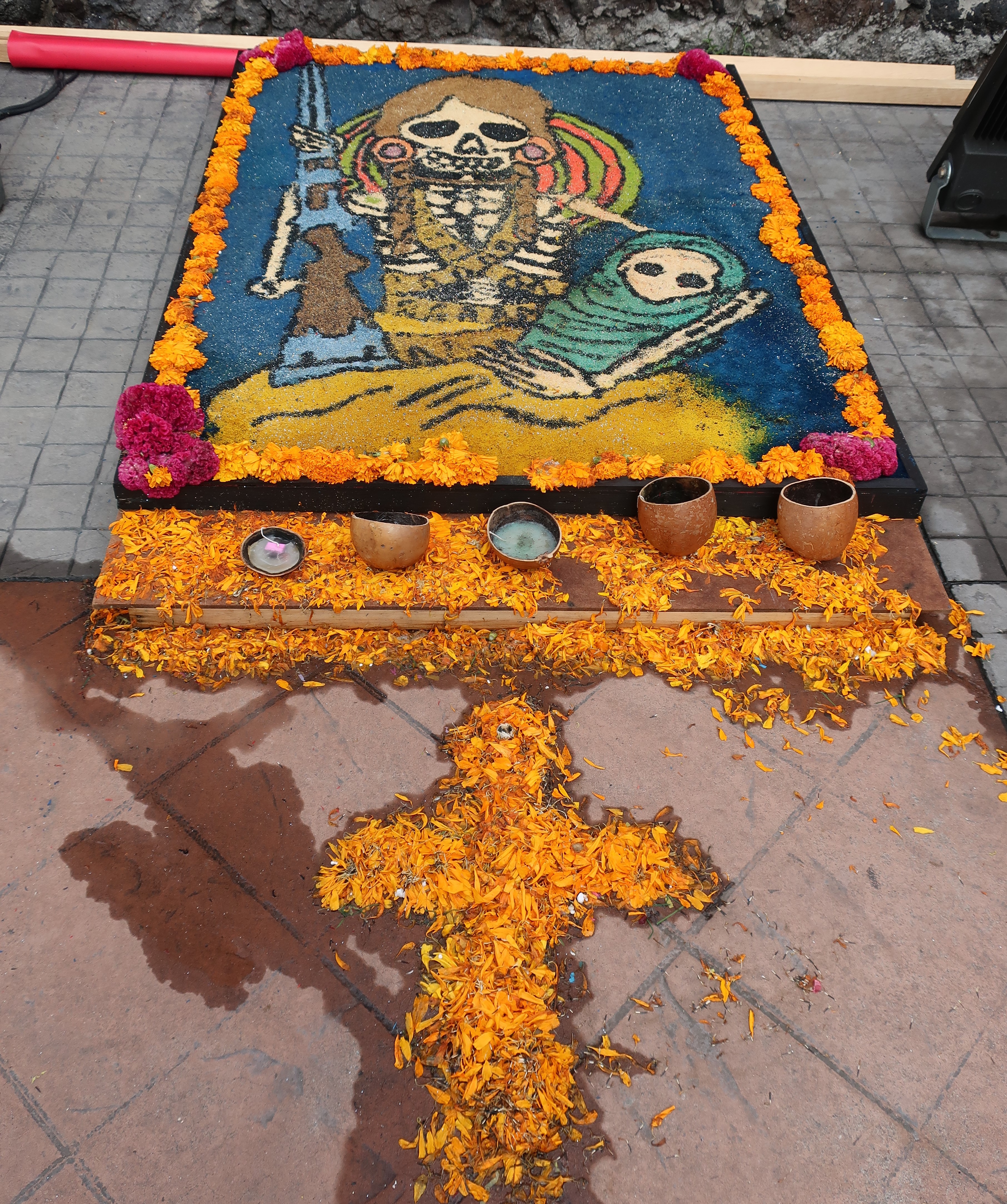 Día de Muertos ofrenda decorated with marigolds and candles at the Museo Nacional de las Culturas Populares in Mexico City