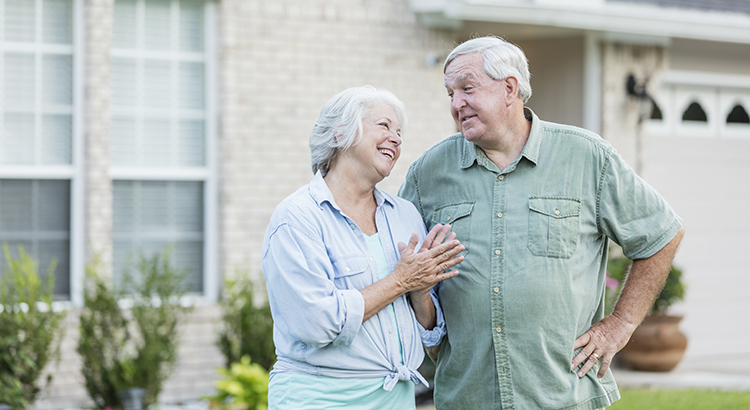 Retired couple discussing home prices