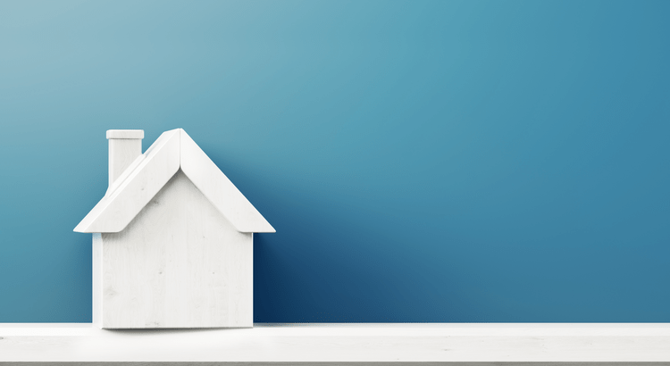 Plain house on blue background general housing market update
