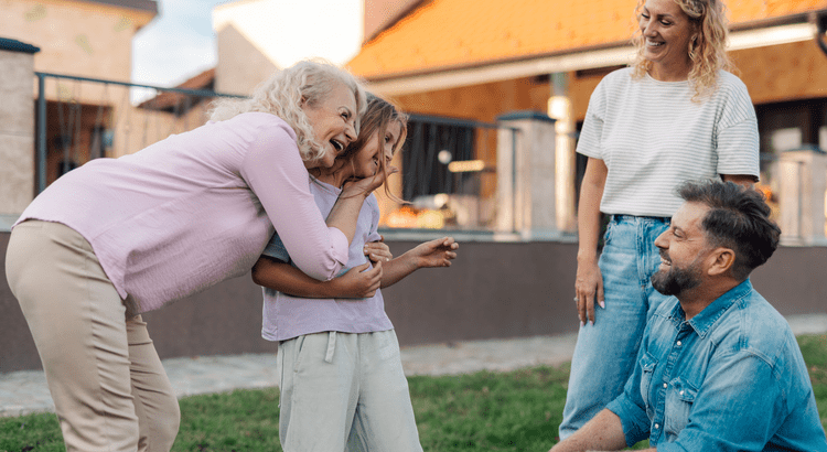 Active grandmother outside with granddaughter