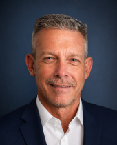 Headshot of David, a firefighter‑turned‑Realtor, presenting a friendly and approachable professional appearance.