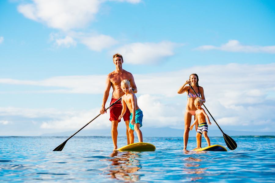 Have fun paddleboarding near Florida homes.