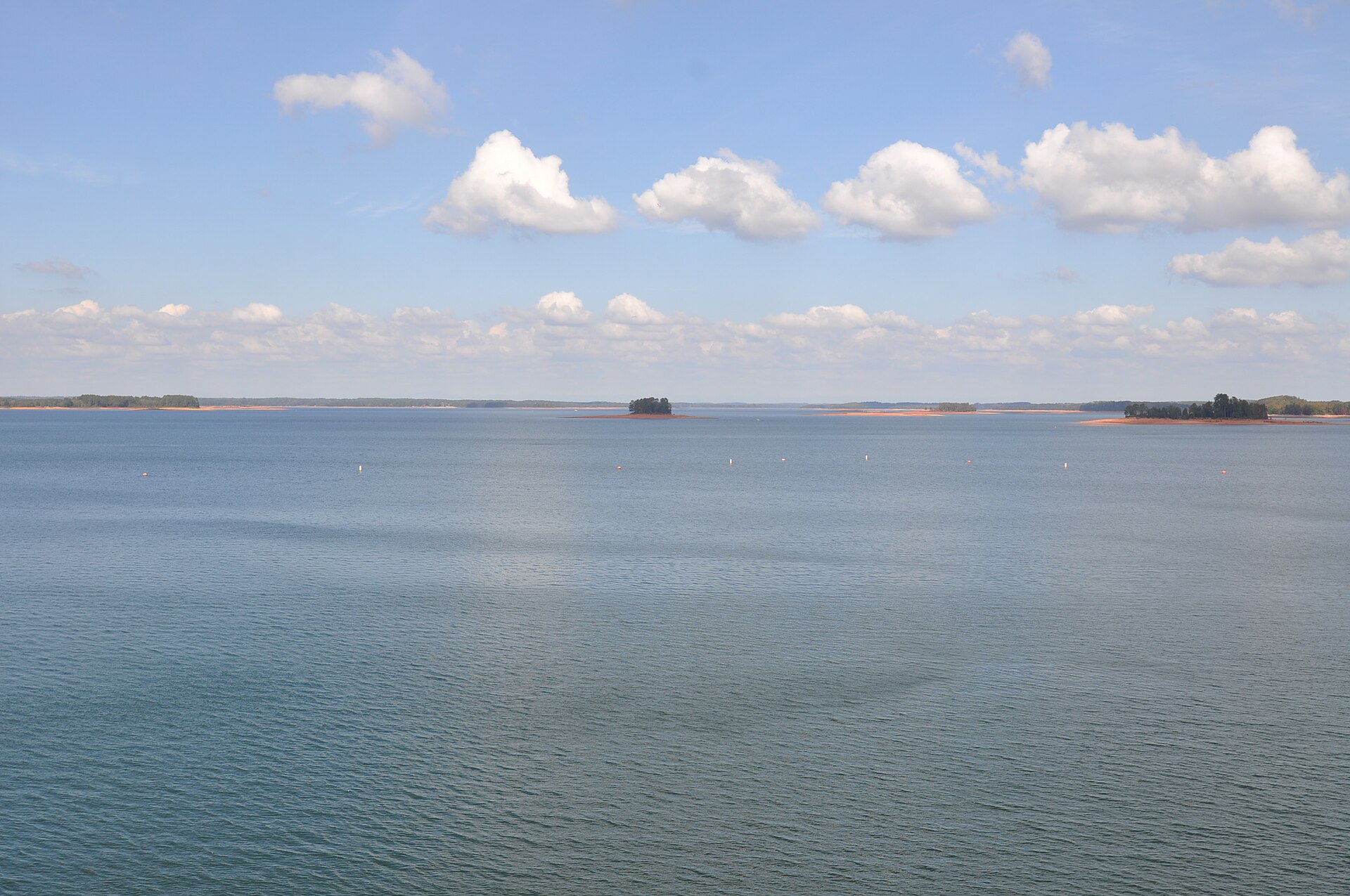 Calm water and wooded shoreline on Lake Hartwell in the fall