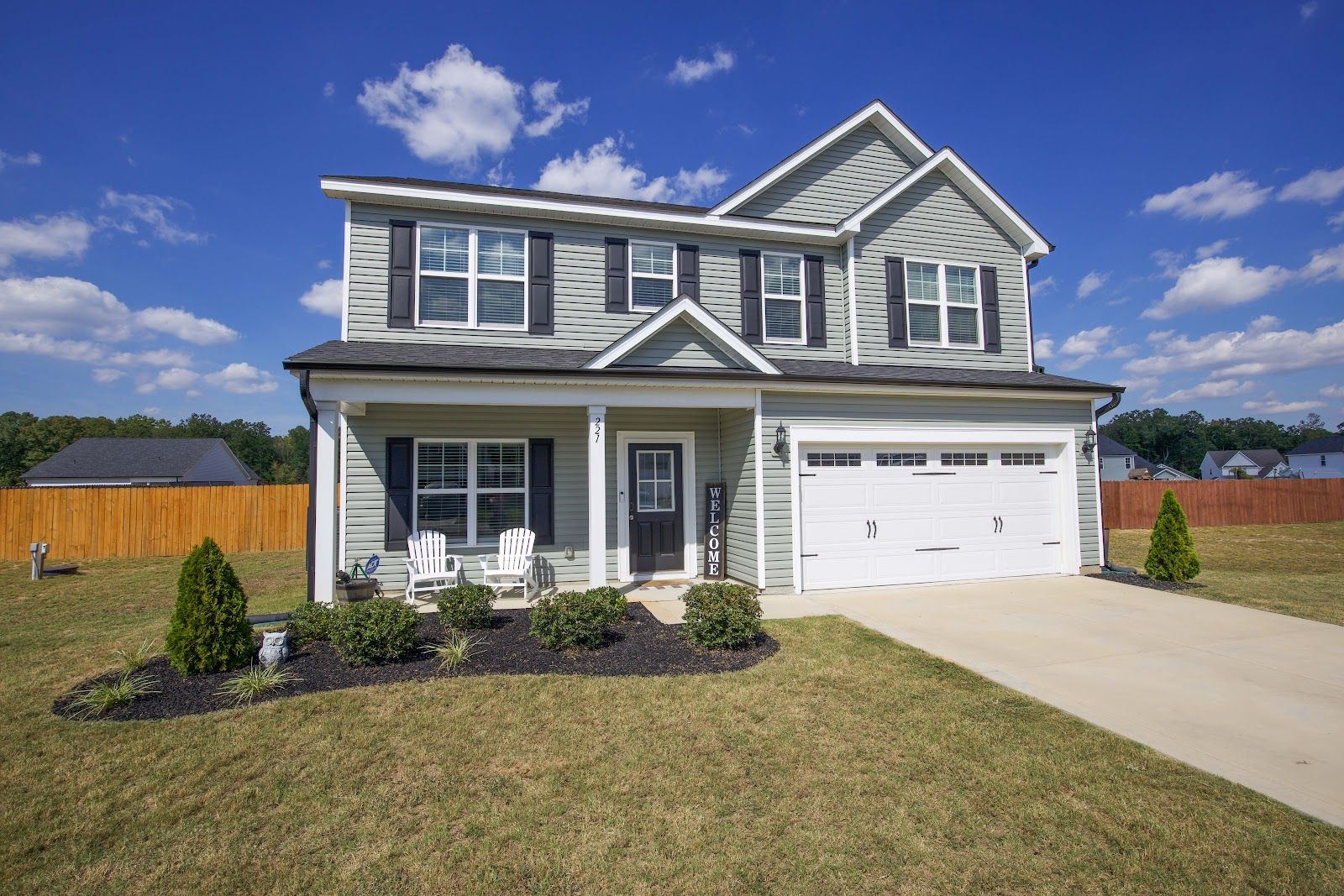 221 Vega Lane in Linden, NC, a two-story 4-bedroom home built in 2024 with a covered front porch and two-car garage