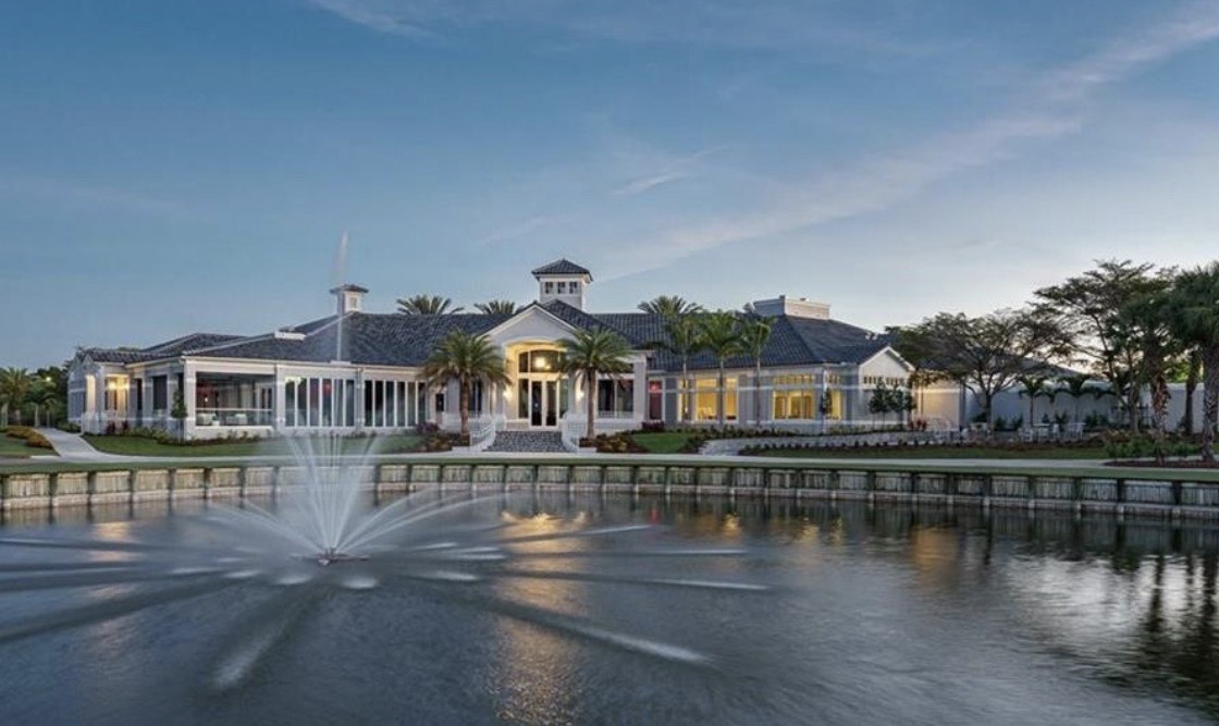This image features an elegant single-family home situated in a prestigious gated community in Fort Myers, showcasing a screened lanai that offers beautiful views of the nearby golf course. The property is designed with a spacious open split floor plan, highlighting its attractive features and tranquil setting, ideal for enjoying the active SWFL lifestyle.