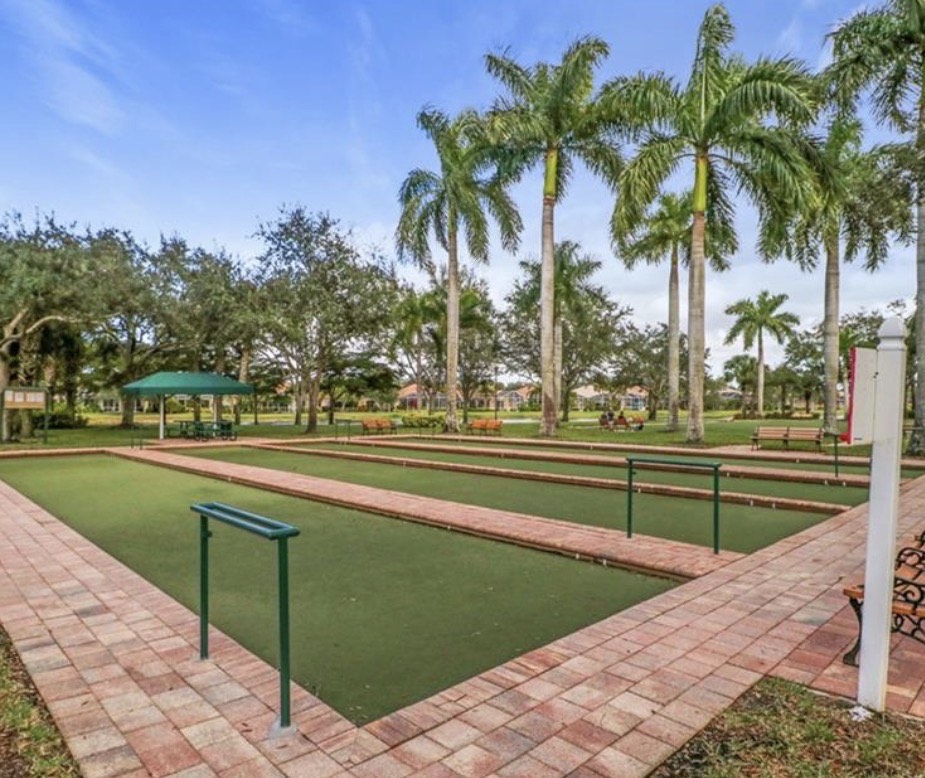 The image showcases the interior of Village Walk's town center, featuring a cozy cafe area with comfortable seating, perfect for enjoying morning coffee or entertaining friends. This beautifully maintained community offers all the amenities residents desire, including on-site dining and a tranquil atmosphere.