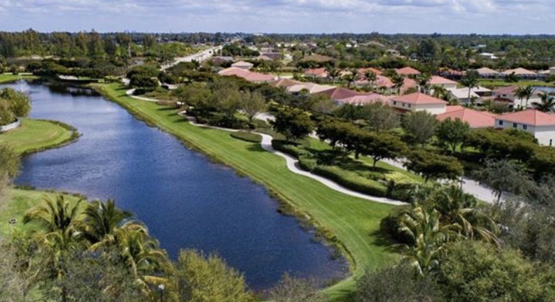 This image depicts a beautiful waterfront home in Sandoval, featuring a private dock and direct canal access, perfect for those interested in Cape Coral real estate. The property is situated in a gated community and showcases resort-style amenities, making it an ideal dream home for prospective property consumers.