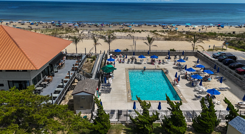 The Ocean Pines Beach Club property on the ocean-side block between 49th and 50th Streets in Ocean City, MD, with permit parking and pool deck
