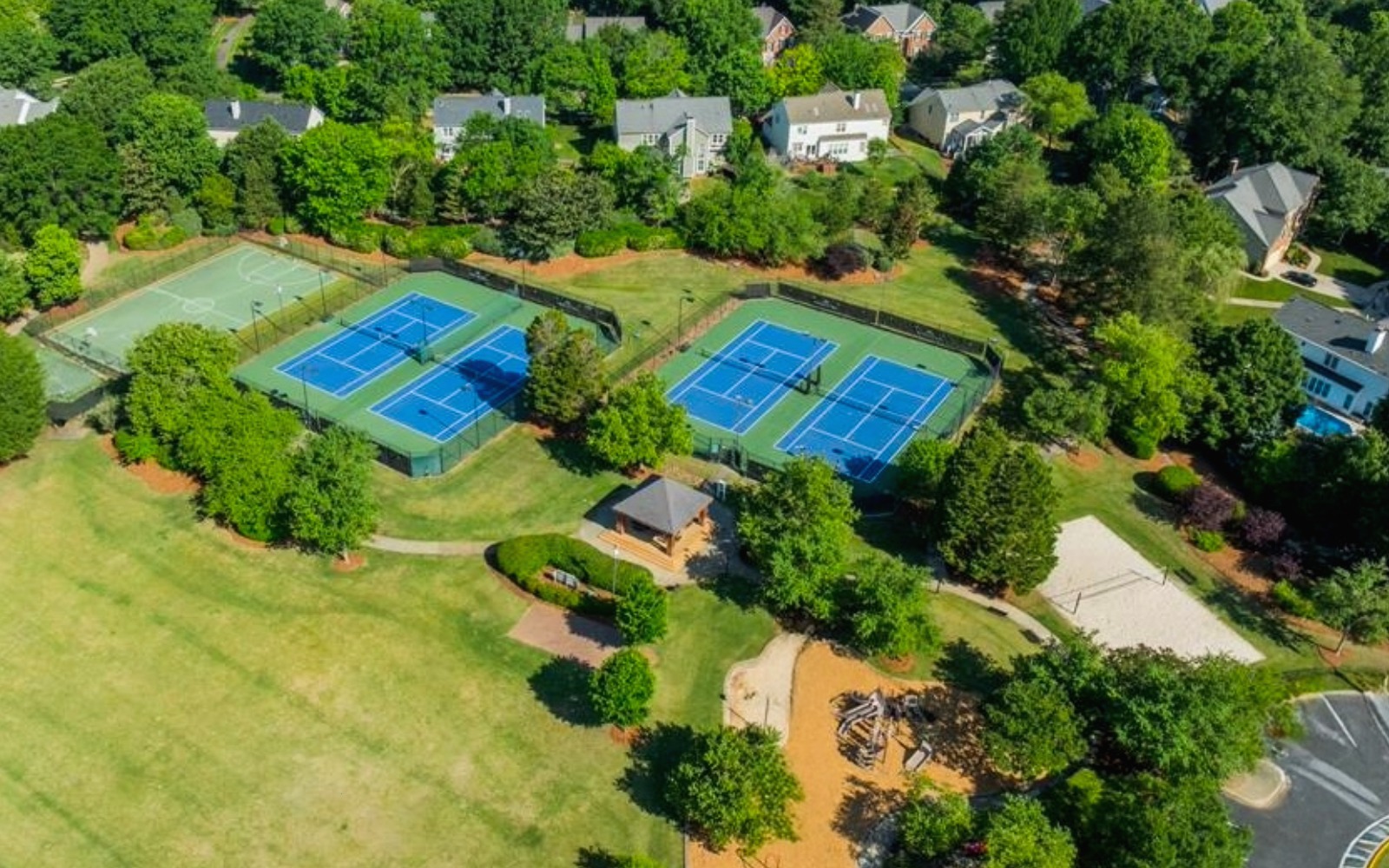Tennis basketball volleyball courts and playground in Highland Creek