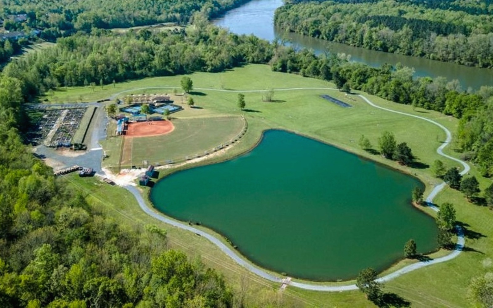 Baseball field running track and pond at Sun City at Carolina Lakes