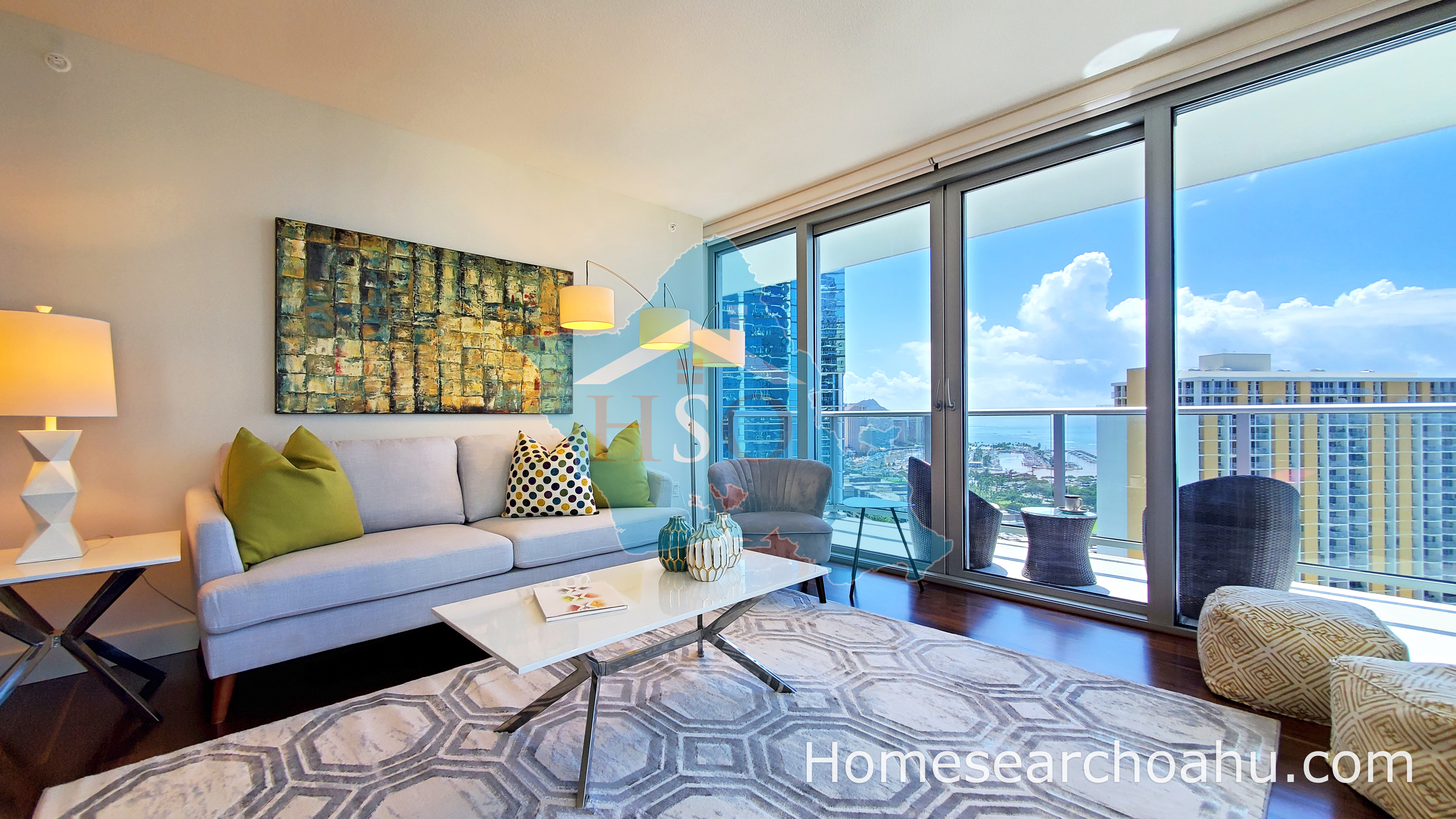 Waihonua Living Room featuring wood flooring and floor to ceiling windows