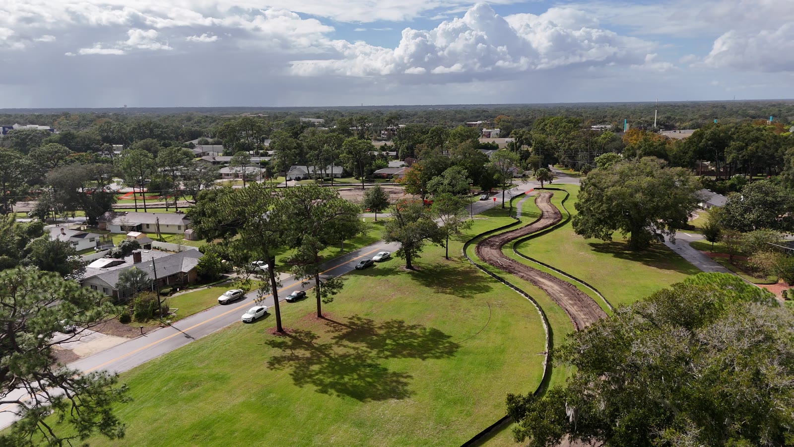 Rolling Hills trail construction from the air Aerial drone view of the new Rolling Hills trail being cut through former fairways in Longwood, with homes and the street alongside