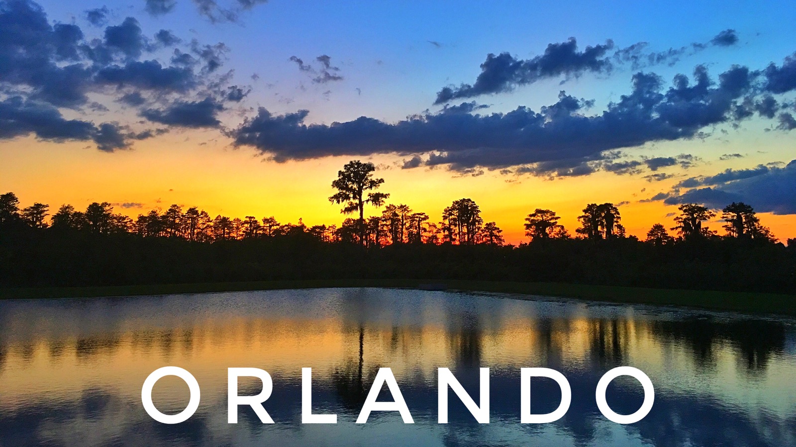 Central Florida lake reflecting a colorful sunset