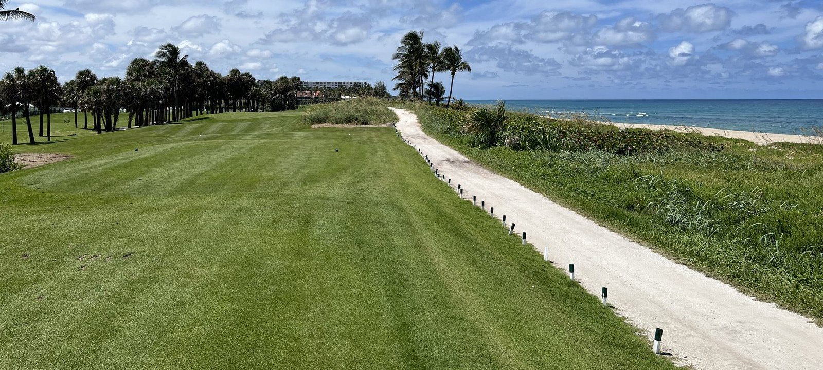 A fairway running toward the ocean
