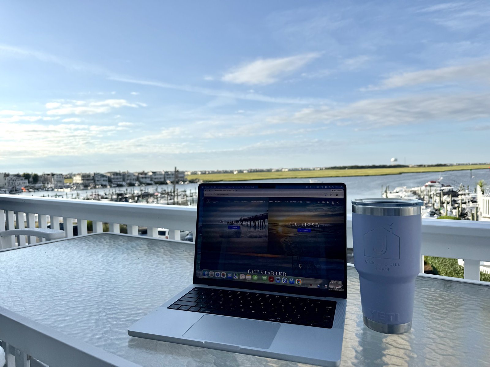 A laptop on a deck above the marina at Ocean City, New Jersey