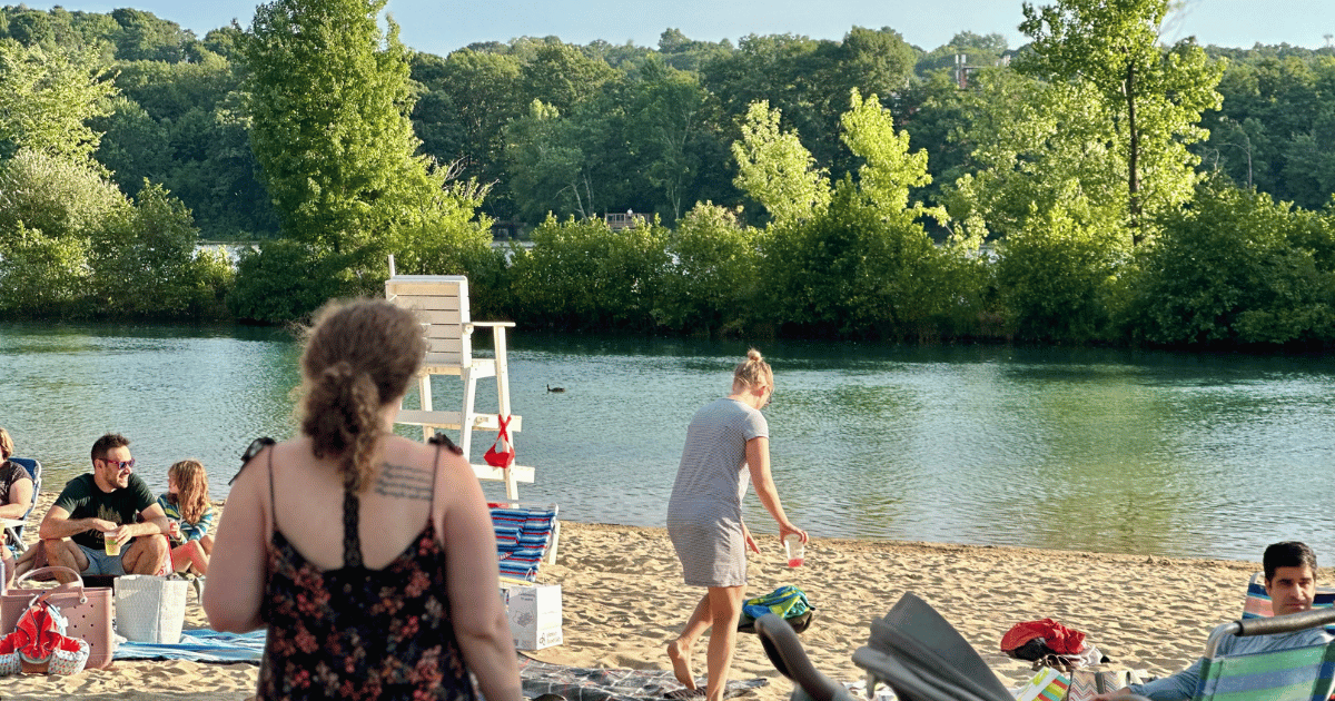 People hanging out at the beach for the event. 