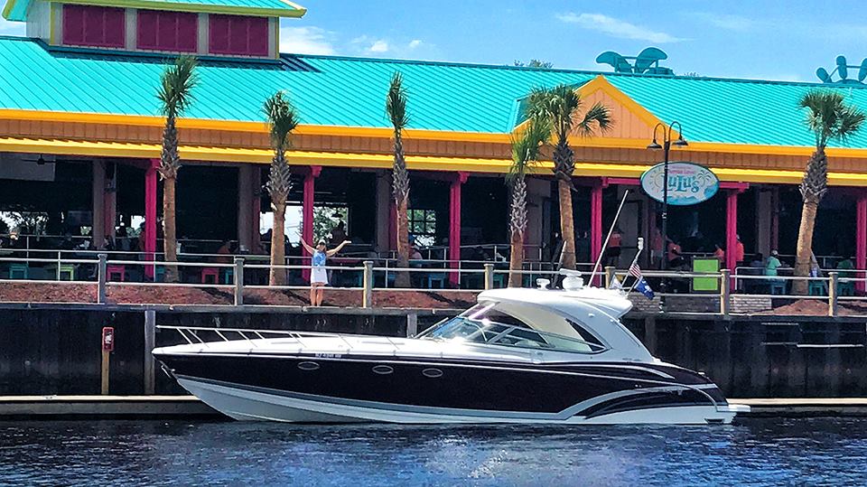 boat in front of Lulus Barefoot Landing