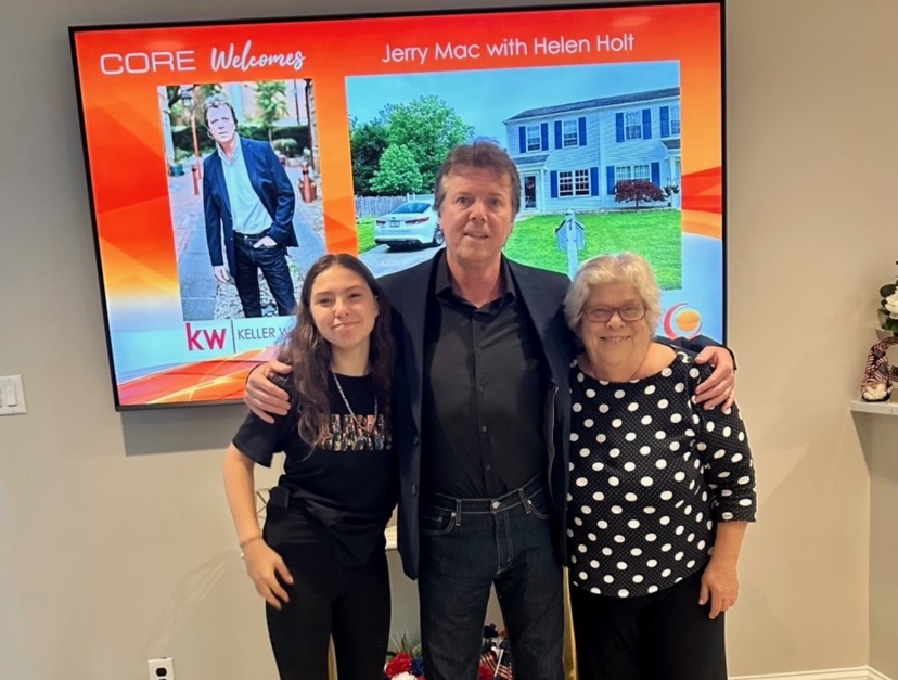 Jerry Mac of Keller Williams smiling with two of his clients