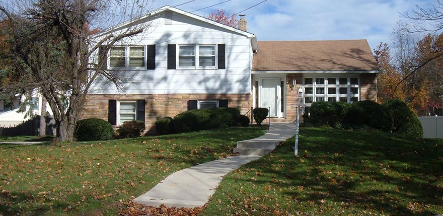 two story cherry hill home with large front yard