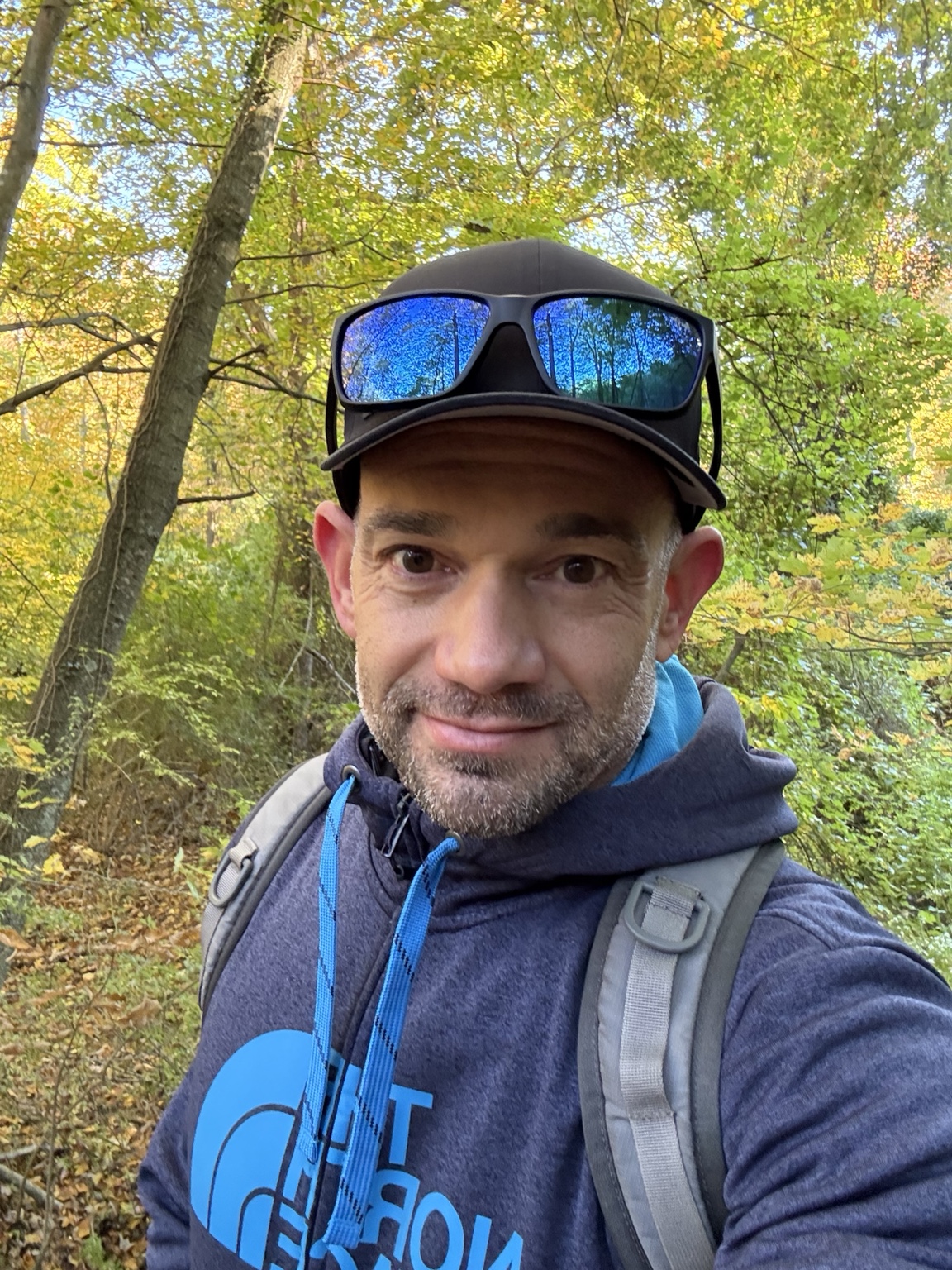 John Cordeira on the Nassau-Suffolk Trail amid October foliage at Cold Spring Harbor