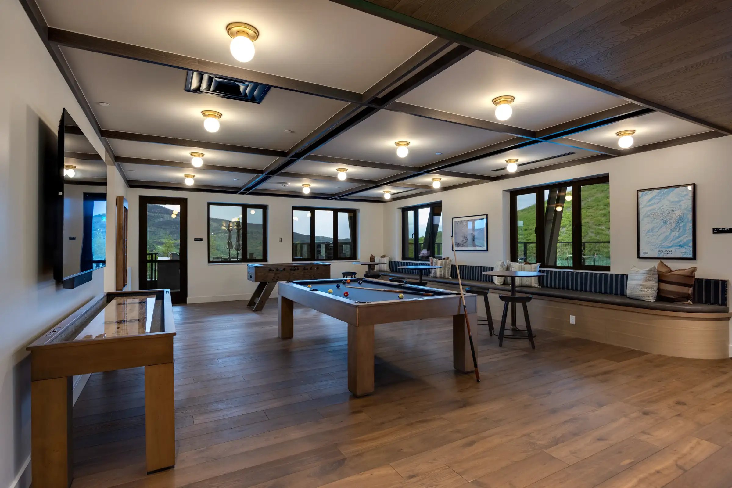 Amble game room with pool table