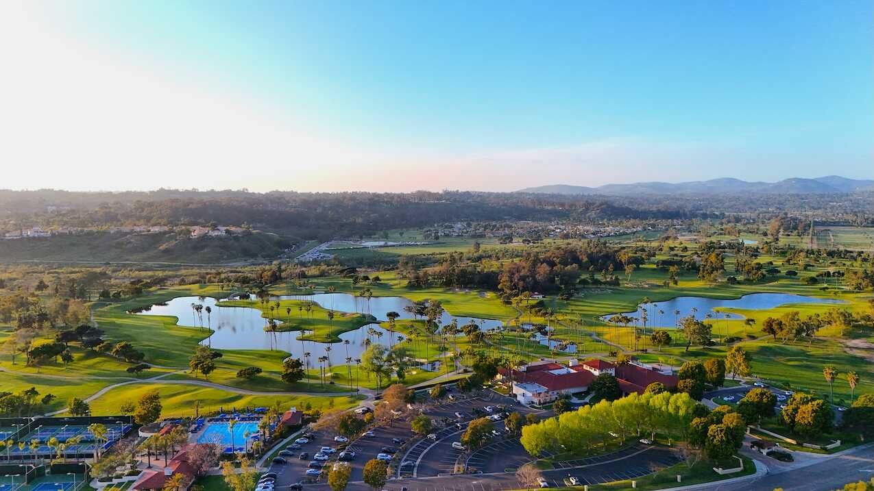 Elegant Rancho Santa Fe estate with landscaped grounds representing homes for sale in the area