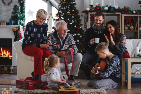 Cozy living room with a fireplace and a family gathered around, sharing moments of joy