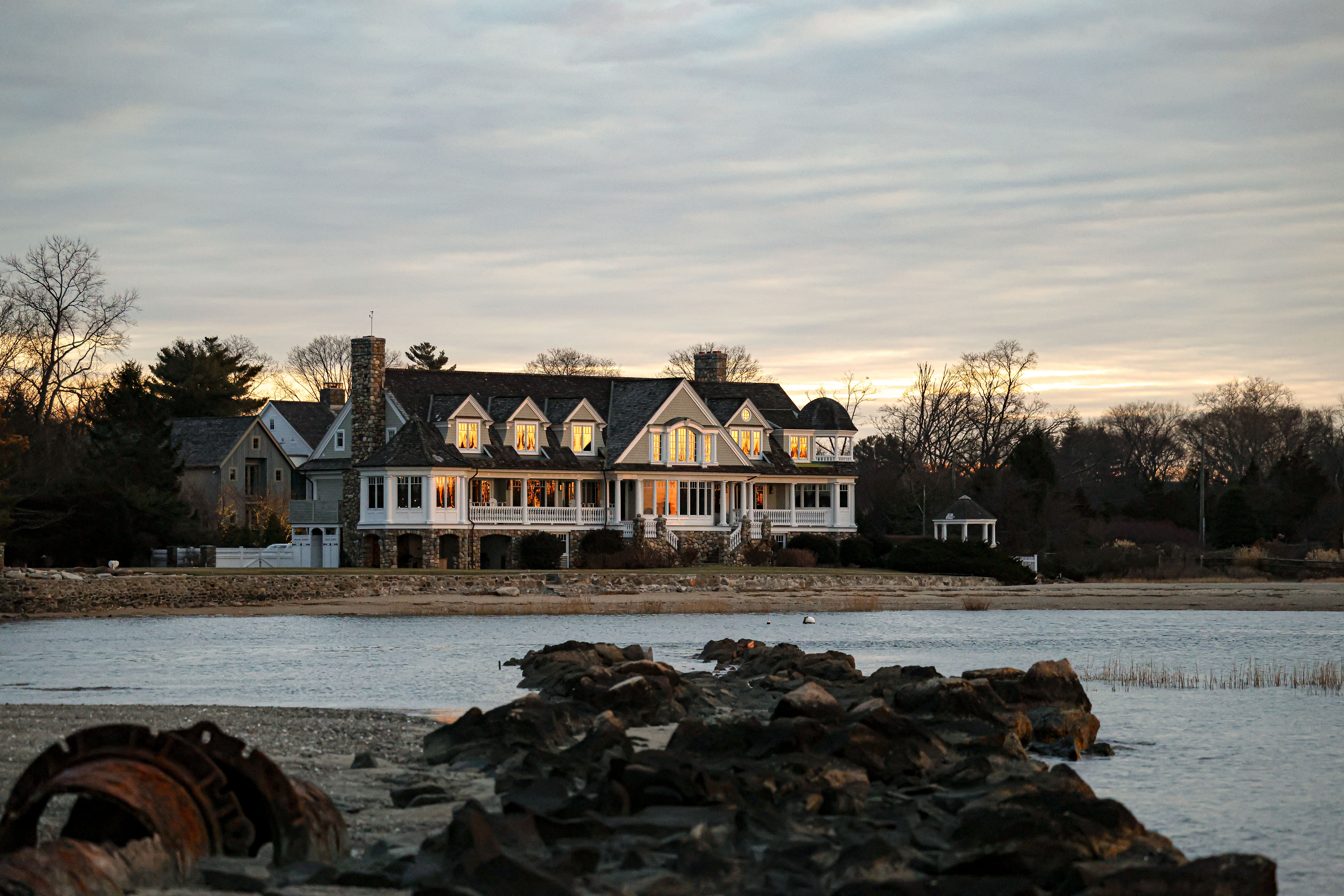 elegant waterfront estate at twilight