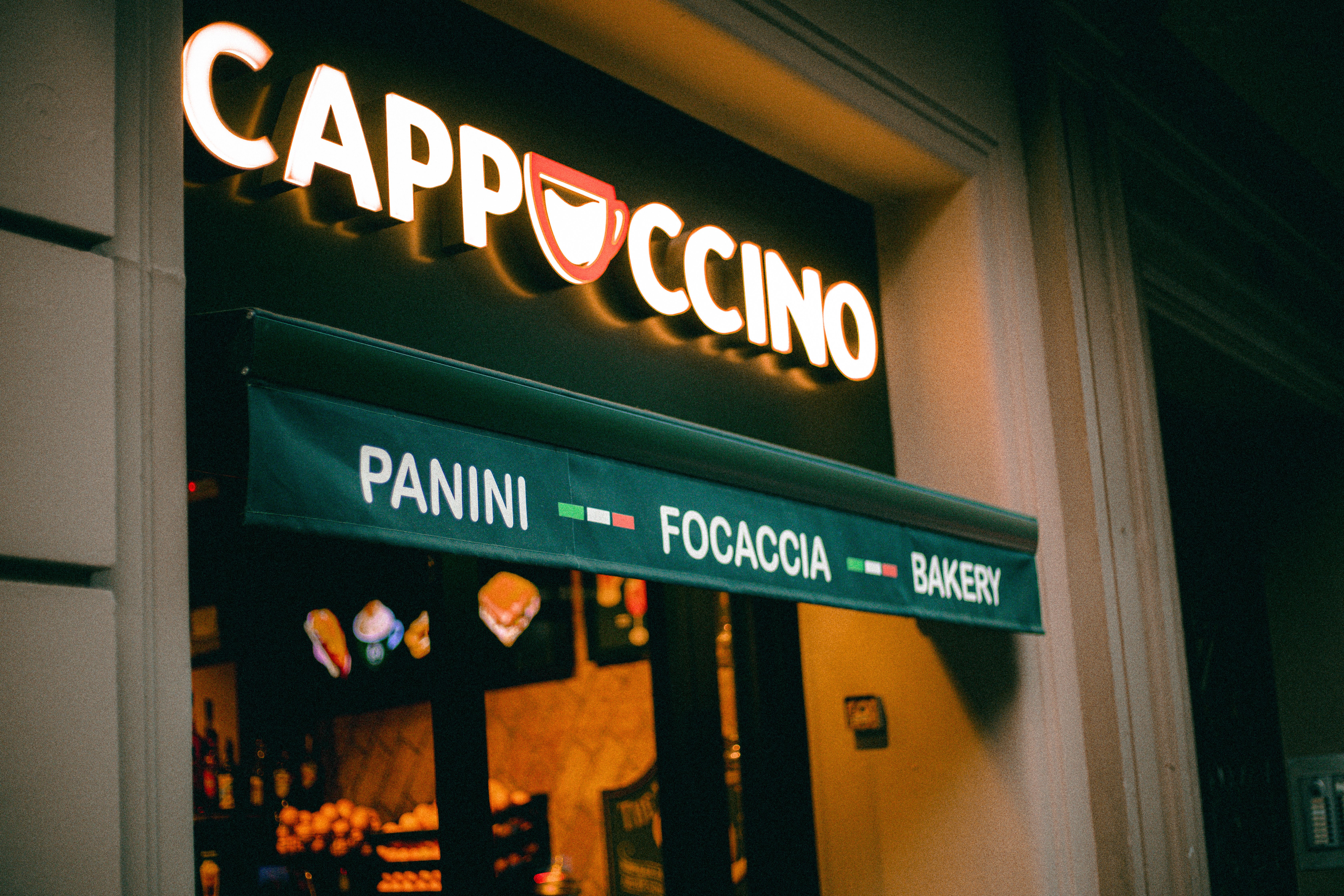 cozy italian cafe exterior sign with menu awning