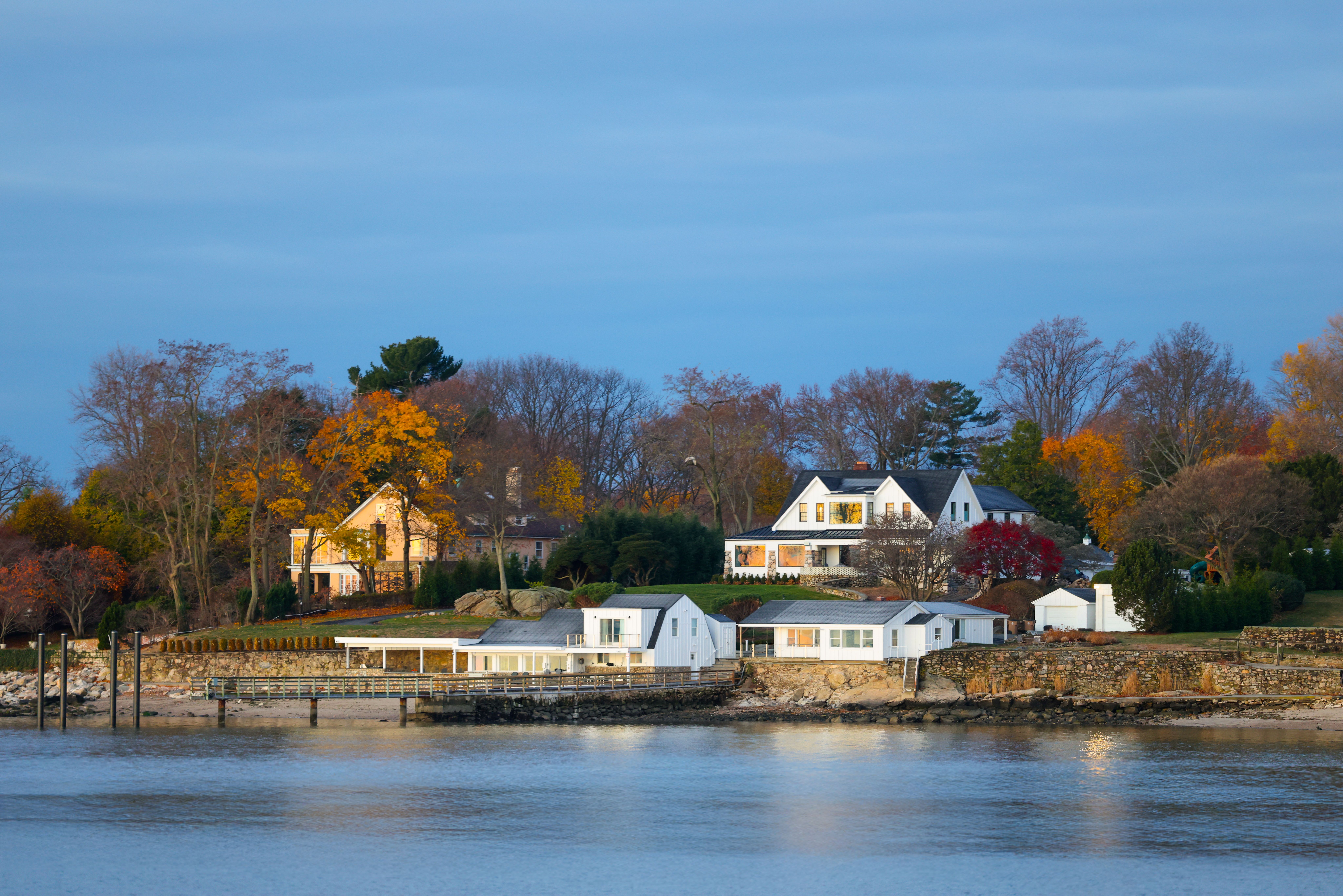 serene autumn view of waterfront homes