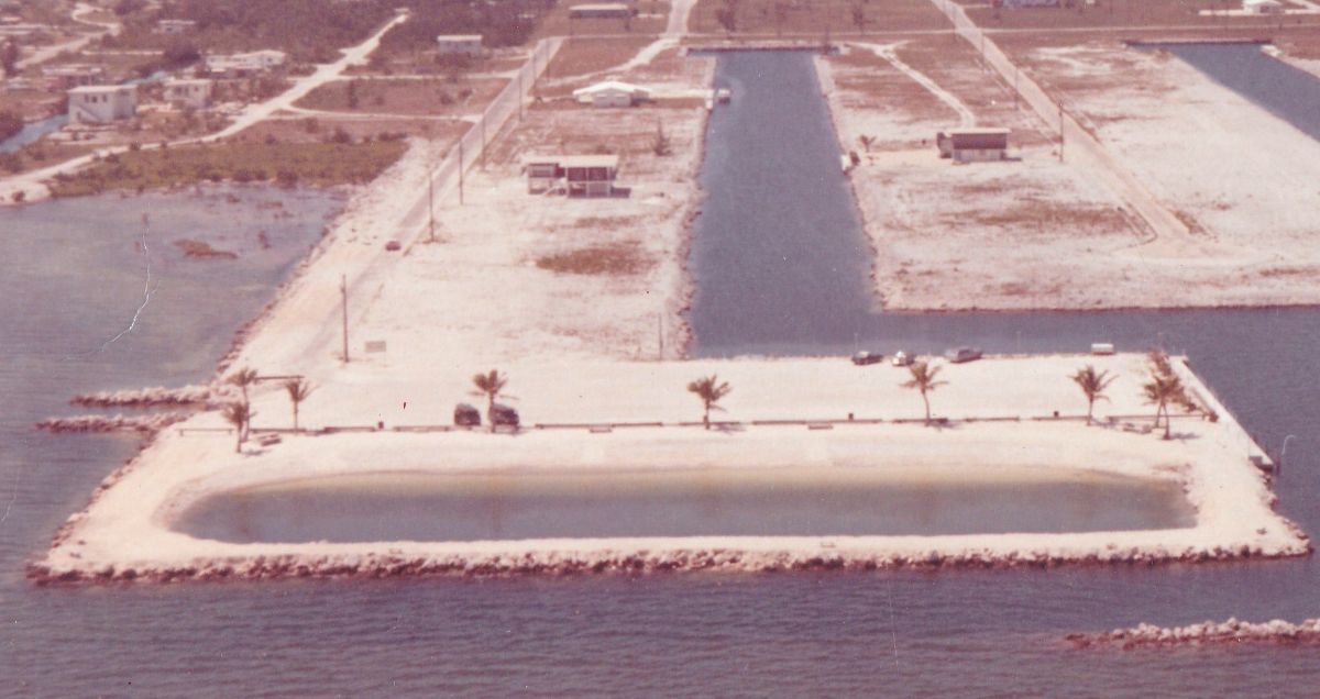 Port Largo vintage aerial showing community park and canal grid, Key Largo, Florida