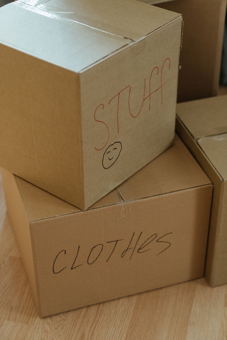 Moving boxes labeled for each room