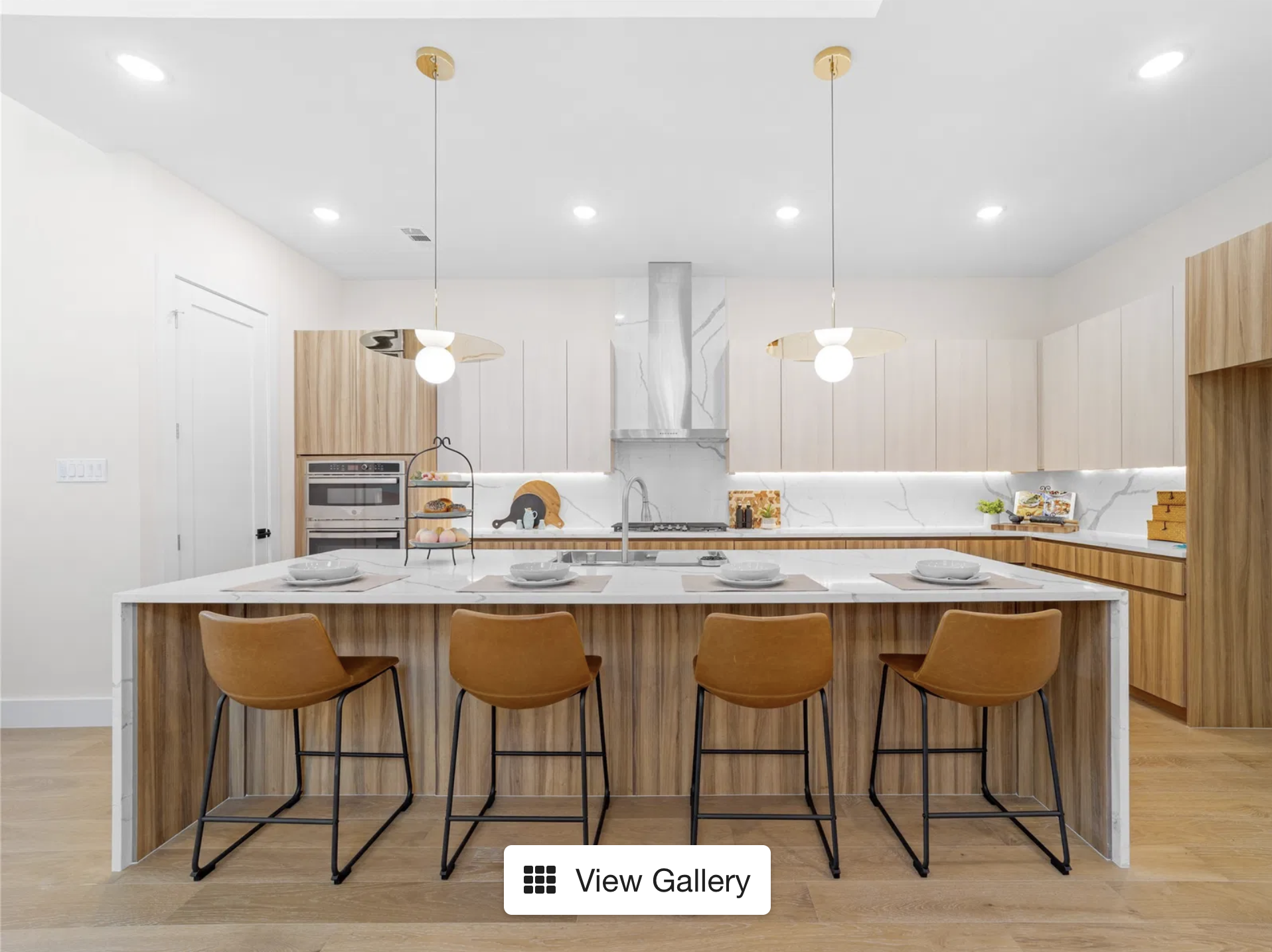 Chef's kitchen with Calacatta quartz waterfall island at 416 Mt Auburn Ave Dallas