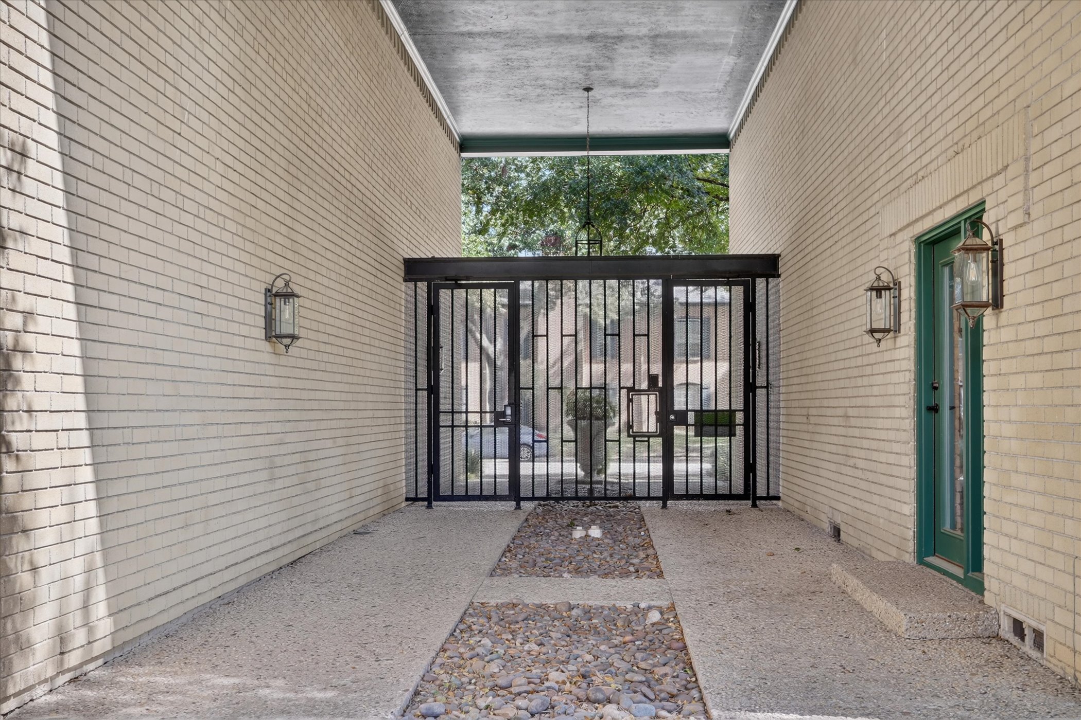 Private gated entry passage at 6020 E University Blvd Unit 117 Dallas